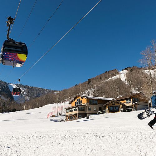 Photo of gondola ascending a ski area