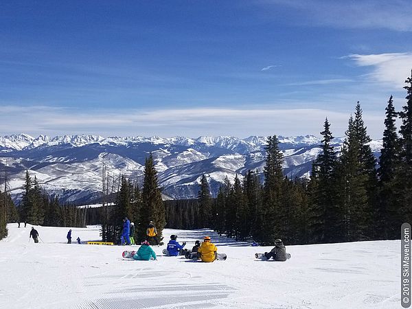Ski and snowboard lessons with a view of the Rocky Mountains