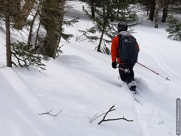 Making ski turns through the snow