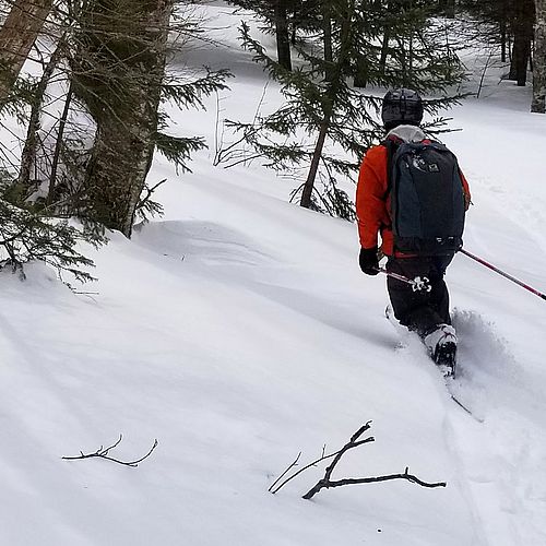 Making ski turns through the snow