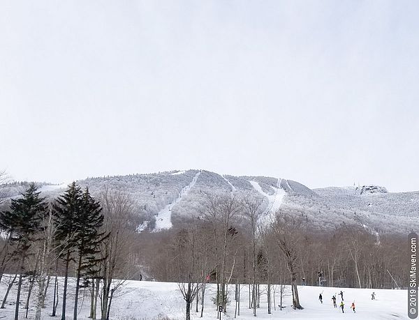 Photo of a distant view of the quad on snowy Mt. Mansfield