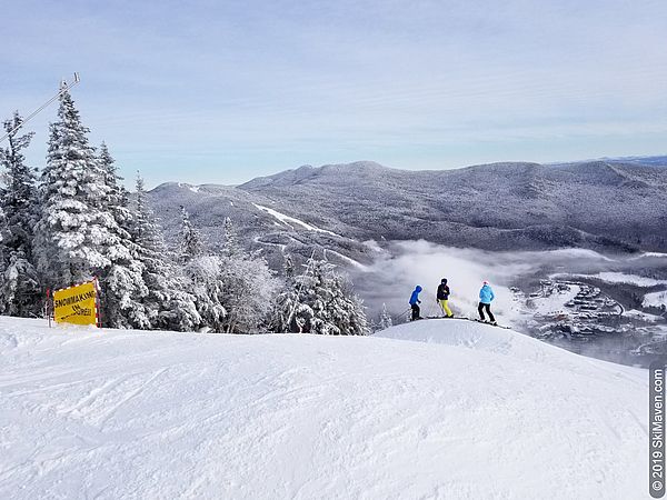 Photo of skiers on snowmaking whales on the Upper Hayride expert run