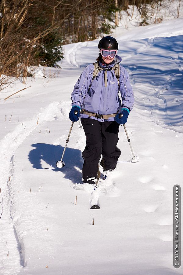 Photo of a skier making a telemark turn