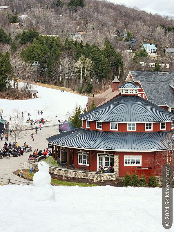 A small snowman with the Sugarbush base area in background