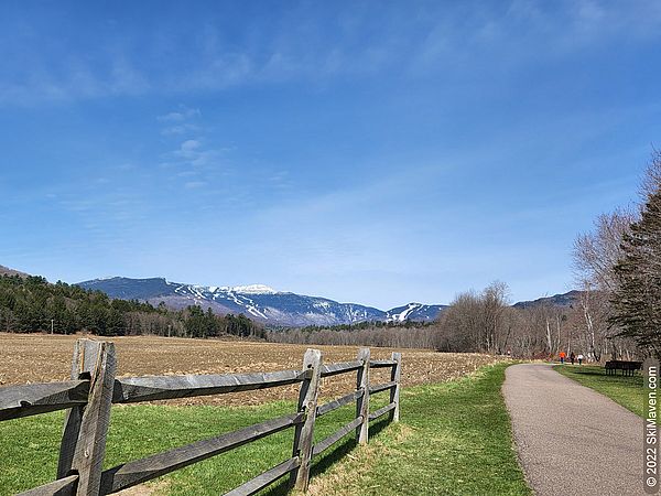 Photo of a rather snowy Mt. Mansfield as seen from the dry Stowe Recreation Path