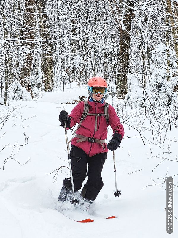 Skier makes a turn in some fresh snow