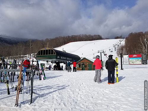 Deals on skiing at Stowe, Vermont Photo of people in snowy base area in Stowe, Vermont