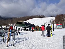 Deals on skiing at Stowe, Vermont Photo of people in snowy base area in Stowe, Vermont
