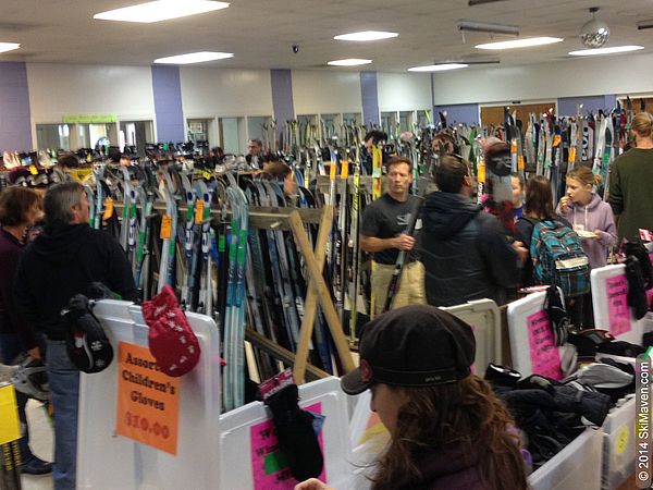 Photo of a Vermont ski swap with lots of skis, gear and people